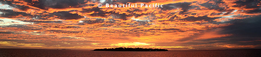 picture of sunset over an uninhabited coral island